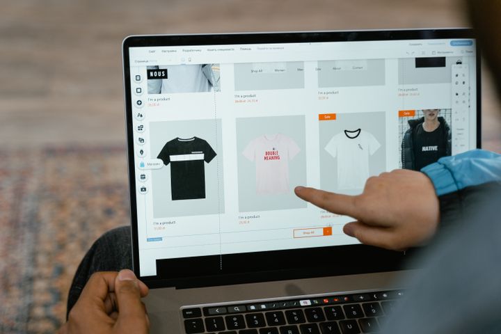 Online store owner working with a laptop on e-commerce orders